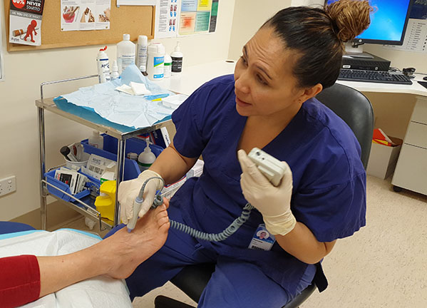 Diabetic podiatrist working on a foot