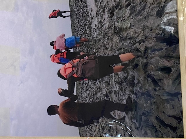 Su Myat Kyaw climbing up mud